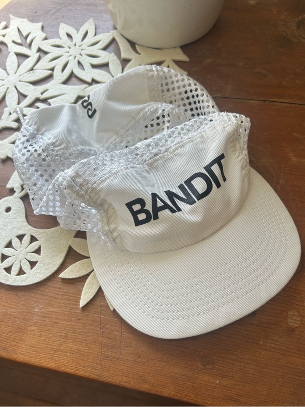 Bandit White Mesh Performance Running Cap for Men.